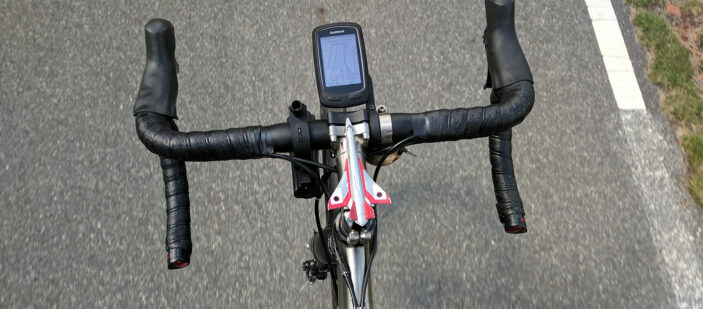 toy plane mounted to the stem of a bicycle